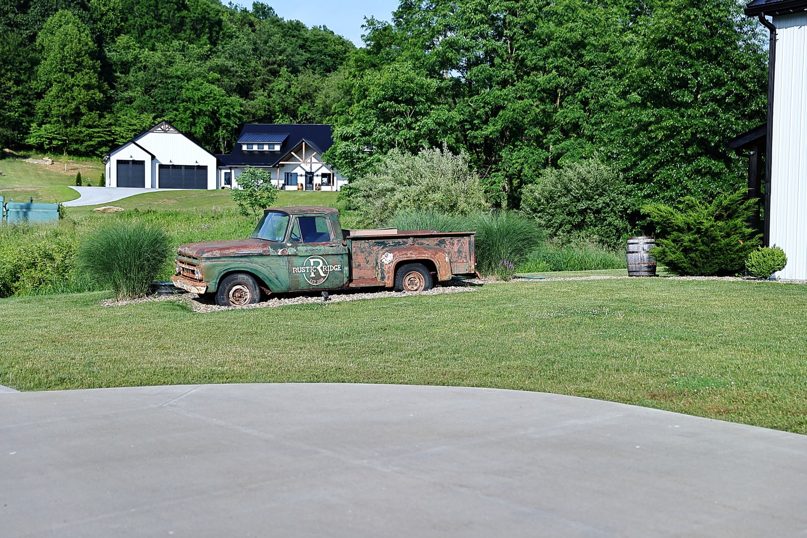 Vintage Rustic Ridge truck Vintage Rustic Ridge pickup truck displayed on the landscaped grounds of the venue